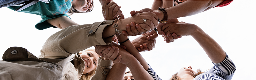 Advising page with a photo from beneath students at SOAR making a knot with their arms.
